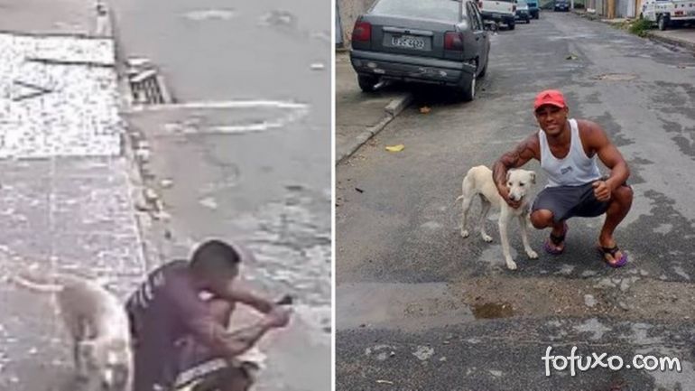 Cachorro faz xixi nas costas de homem sentado na calçada